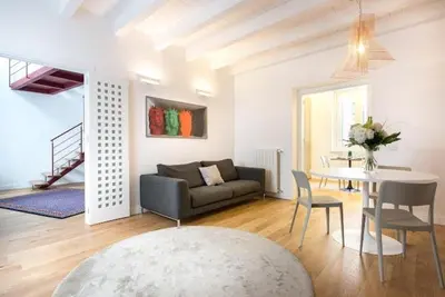 a living room with a couch and a table at Mori apartment Libertà Politeama in Palermo