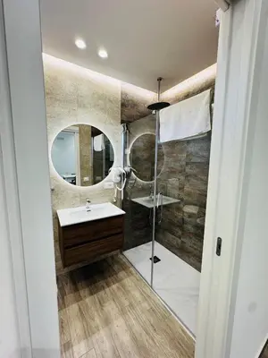 a bathroom with a sink and a shower at Al Grande Pino - Private pool, Jacuzzi and amazing Sunset in Campofelice di Roccella
