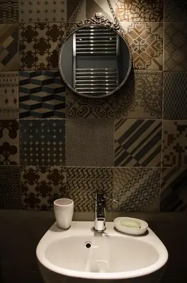 a bathroom with a sink and a mirror at Guelio al Massimo Suites&Breakfast in Palermo
