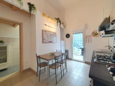 a small white house with two chairs and a pool at Villa Blu Corallo by Interhome in Alcamo Marina