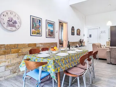 a kitchen with a table and chairs in a room at Villa Blu Corallo by Interhome in Alcamo Marina