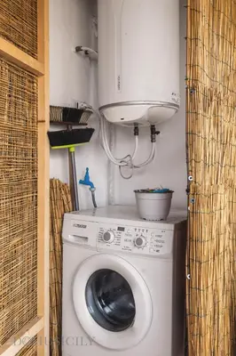 a washing machine with a microwave on top of it at Cala & Cassari View By DomuSicily in Palermo