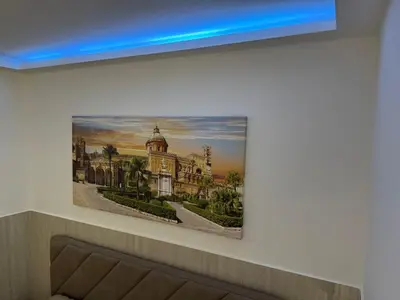 a picture of a building hanging on a wall at Cappellieri centro apartament in Palermo