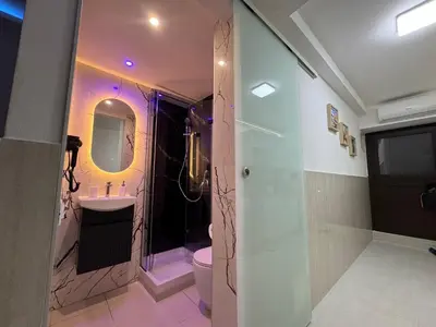 a bathroom with a shower and a toilet and a sink at Cappellieri centro apartament in Palermo