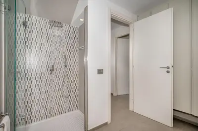 a bathroom with a shower with a glass door at Villa Sikelia con fantastica piscina in Alcamo
