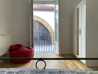 a red bag sitting on the floor in a room at Dai Pupi al 68 in Palermo