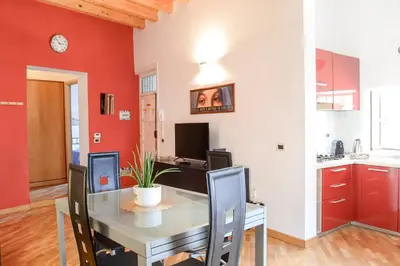a kitchen and dining room with a table and chairs at Appartamento moderno tra Stazione, Via Maqueda e Ballarò in Palermo