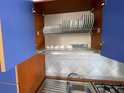 a kitchen with a sink and a counter top at Sweet Summer House in Campofelice di Roccella