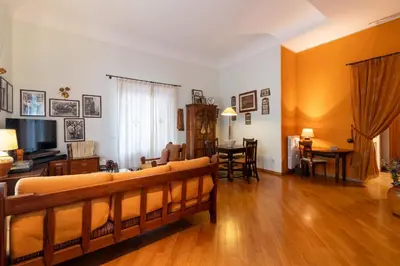 a living room with a couch and a dining room at GuestHost - Casa Giacomo in central Palermo in Palermo