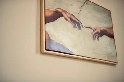 a painting of two hands on a wall at Dimora Beatrice in Termini Imerese
