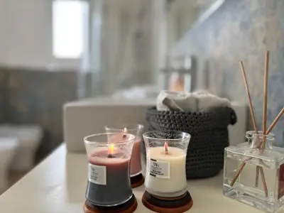 two candles are sitting on a table in a room at Sampolo Rooftop - Palermo View in Palermo