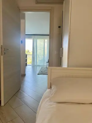 a bedroom with a bed and a large mirror at Comfy Holiday House in Castellammare del Golfo