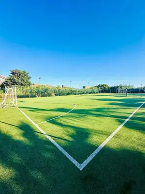 an empty soccer field with a goal at Comfy Holiday House in Castellammare del Golfo