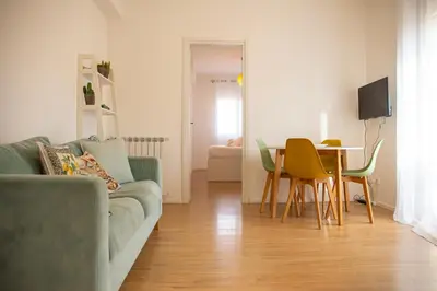 a living room with a couch and a table at Solemar Sicilia - Casa Alba in Santa Flavia