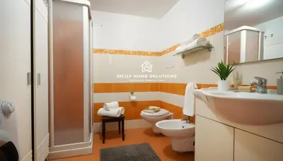 a bathroom with a toilet and a sink and a shower at Charming Loft near the Sea - Castellammare del Golfo by Sicily Home Solutions in Castellammare del Golfo