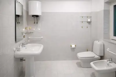 a bathroom with a toilet and a sink and a shower at A due passi dal Teatro Massimo in Palermo