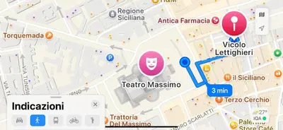 a building on the side of a street with cars parked at A due passi dal Teatro Massimo in Palermo