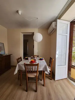 a dining room with a table and chairs and a window at Casa Rubino al Massimo in Palermo