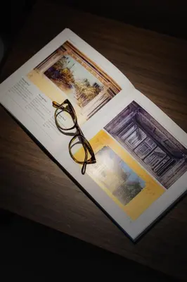 a pair of glasses sitting on top of an open book at Casabea in Palermo