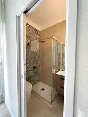 a bathroom with a glass shower and a toilet at Cielo D'Alcamo Palazzo Antichi Quartieri in Alcamo