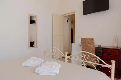 a kitchen with a table with two towels at Cielo D'Alcamo Palazzo Antichi Quartieri in Alcamo