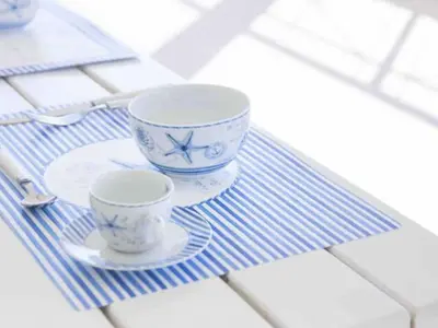 two cups and saucers sitting on a table at Apartment Villa am Meer Trappeto by Interhome in Trappeto