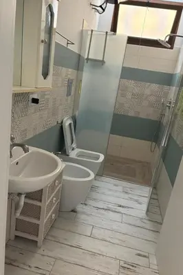a bathroom with a sink and a toilet and a shower at Apartment Wohnung 8 by Interhome in Balestrate