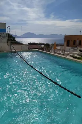 a pool of blue water with a rope at Apartment Ferienhäuser Small App- für 5 in Balestrate by Interhome in Balestrate