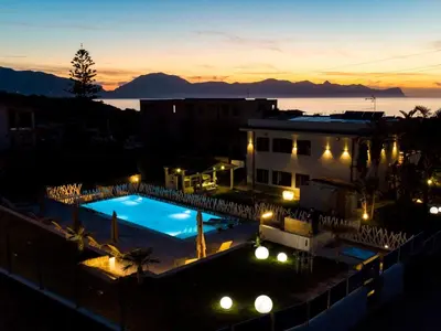 a view of a swimming pool at night at Apartment Wohnung GIallo mit Schwimmbad und Meerblick by Interhome in Balestrate