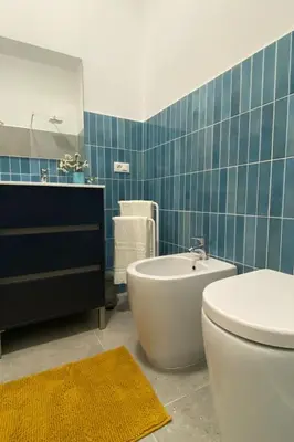 a bathroom with a toilet and a tub and a sink at Apartment Casa La Mamà- Strand 150 m entfernt by Interhome in Alcamo