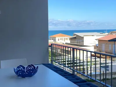 a view of the ocean from a balcony at Apartment Casa La Mamà- Strand 150 m entfernt by Interhome in Alcamo