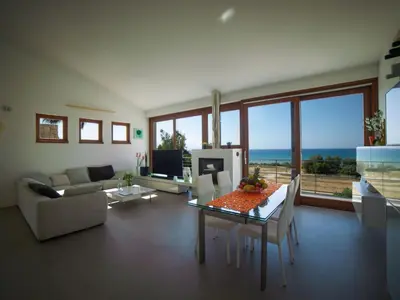 a living room with a couch and a table at Holiday Home Villa in Sizilien am Meer mit beheiztem Pool by Interhome in Alcamo Marina