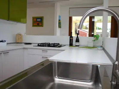 a kitchen with a sink and a counter top at Holiday Home Villa in Sizilien am Meer mit beheiztem Pool by Interhome in Alcamo Marina