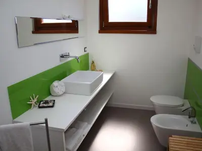 a bathroom with a sink and a toilet at Holiday Home Villa in Sizilien am Meer mit beheiztem Pool by Interhome in Alcamo Marina