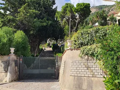 a gate to a house with stairs in front at Holiday Home Villa Tommaso Maruggi Jacuzzi und privater Pool by Interhome in Alcamo