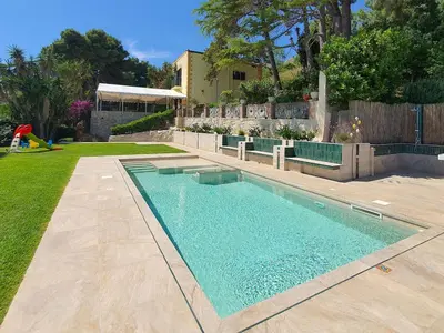 a swimming pool in a yard next to a house at Holiday Home Villa Tommaso Maruggi Jacuzzi und privater Pool by Interhome in Alcamo