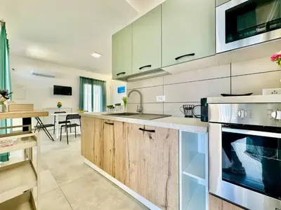 a kitchen with a sink and a stove at Apartment Sea Life Giulia- 200 m vom Strand entfernt by Interhome in Alcamo Marina