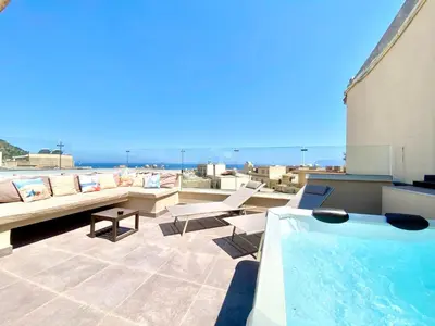a rooftop patio with a swimming pool and furniture at Apartment GS Urlaub del Golfo Haus mit Jacuzzi by Interhome in Castellammare del Golfo