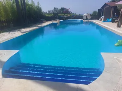 a swimming pool with blue water at Holiday Home Entspannung- Meer- Natur- Kultur by Interhome in Partinico