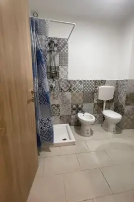 a bathroom with a toilet and a shower at Apartment Wohnung maestrale Sizilien home by Interhome in Balestrate