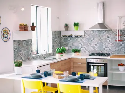 a kitchen with yellow chairs and a table and a sink at Holiday Home in Partinico mit Privatem Pool by Interhome in Balestrate
