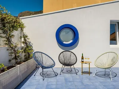 two chairs and a table on a patio at Apartment BluOltremare-Terrasse by Interhome in Castellammare del Golfo