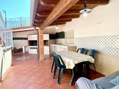 a dining room with a table and chairs on a patio at Holiday Home Villa Grace- Strand 200 m entfernt by Interhome in Alcamo