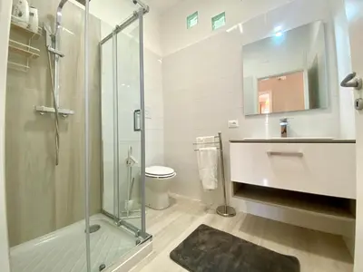 a bathroom with a shower and a sink and a toilet at Holiday Home Villa Grace- Strand 200 m entfernt by Interhome in Alcamo