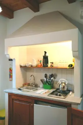 a kitchen with a sink and a stove at Holiday Home Manderino-Panoramasuite mit Park und Pool by Interhome in Santa Flavia