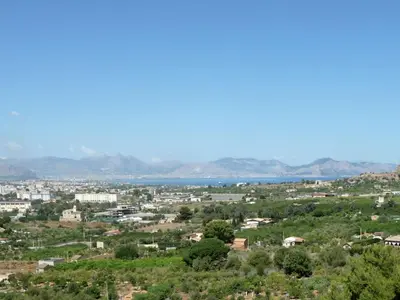 a cityscape of a city with mountains in the background at Holiday Home 'Suite Zibibbo' mit Aussicht by Interhome in Santa Flavia