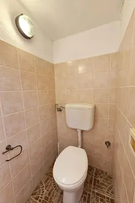 a bathroom with a white toilet in a room at Holiday Home Villa mit Wasserblick by Interhome in Campofelice di Roccella