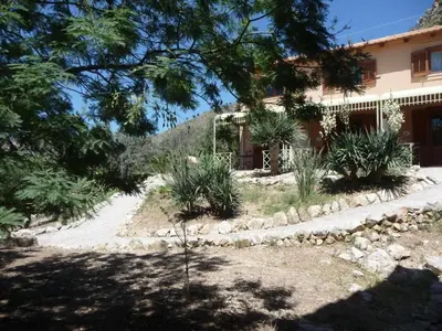 a house with plants in front of it at Holiday Home 'Suite Ficodindia by Interhome in Santa Flavia