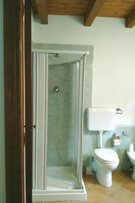 a bathroom with a glass shower with a toilet at Holiday Home 'Suite Ficodindia by Interhome in Santa Flavia