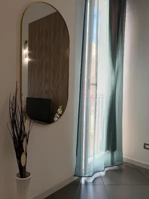 a bedroom with two beds with white towels on them at VITALENTA Palermo apartment in Palermo